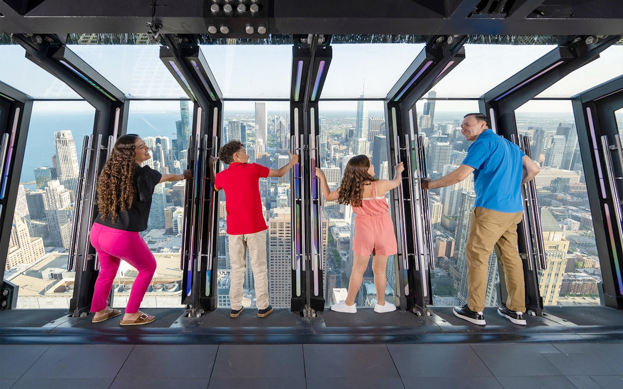 Visitors enjoying the view from Chicago 360 Observation Deck.