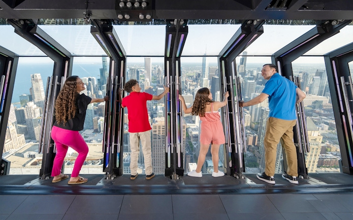 Visitors enjoying the view from Chicago 360 Observation Deck.
