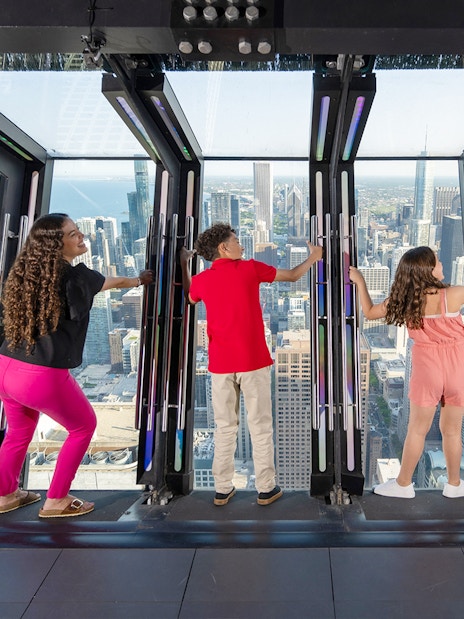 Visitors enjoying the view from Chicago 360 Observation Deck.