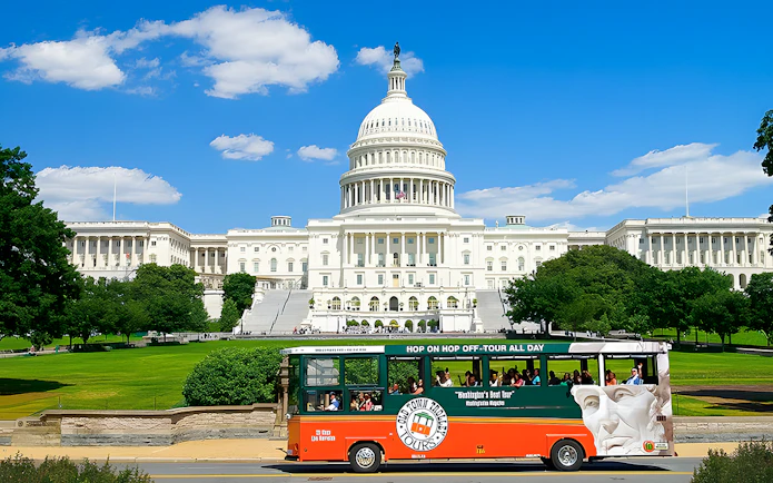 Hop-on hop-off tour bus in front of the U.S. Capitol, Washington DC.