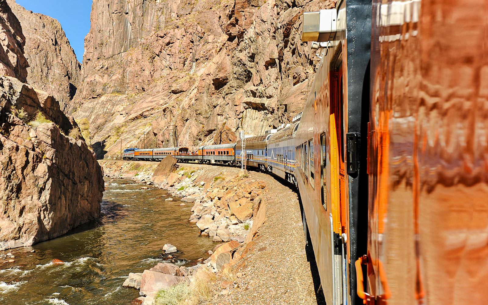 Royal Gorge train crossing a bridge over the Arkansas River in Colorado.