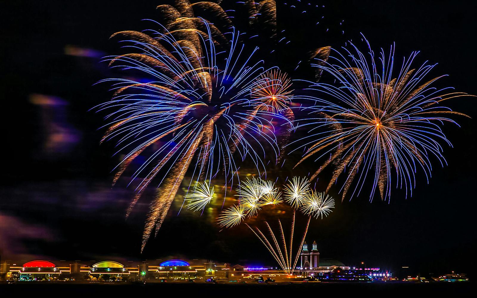 Fireworks display over Chicago Navy Pier at night.