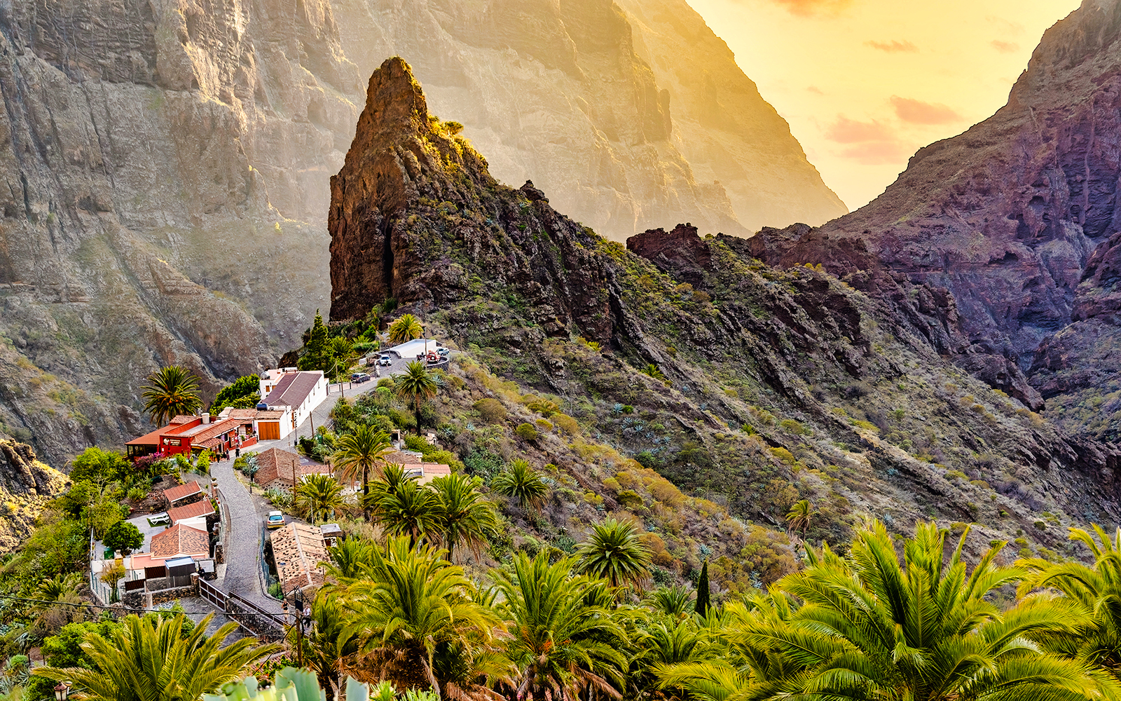 Masca Village nestled in the mountains of Tenerife, surrounded by lush greenery and rocky cliffs.