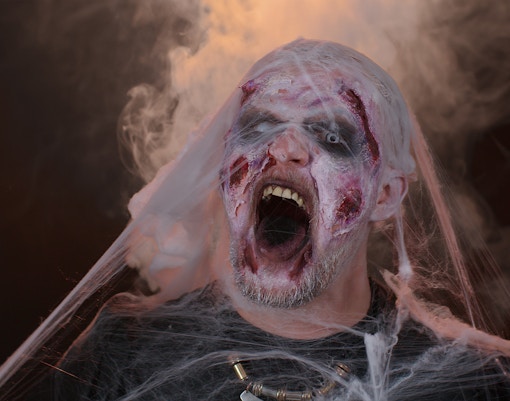Zombie costume with cobwebs at Fright Dome, Las Vegas.