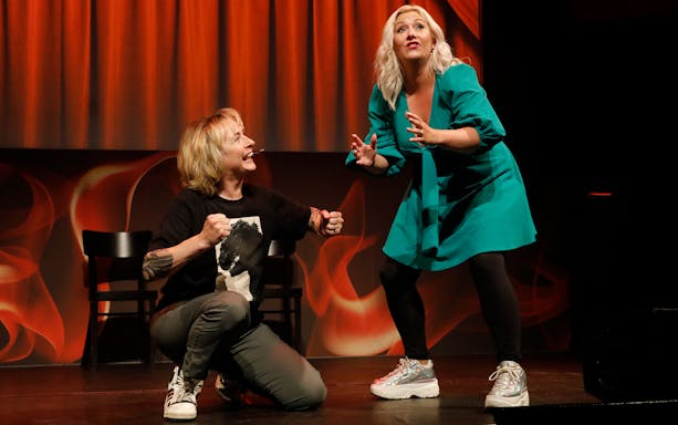 Performers on stage at Boom Chicago Improv Comedy Show in Amsterdam.