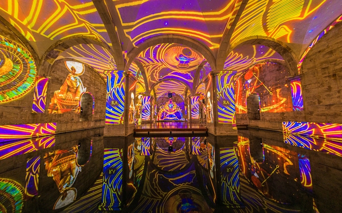 Visitors at Immersivus Gallery Lisbon experiencing an audiovisual show on Ancient Egypt.