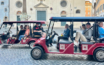 Golf carts with tourists in front of a historic building in Rome.