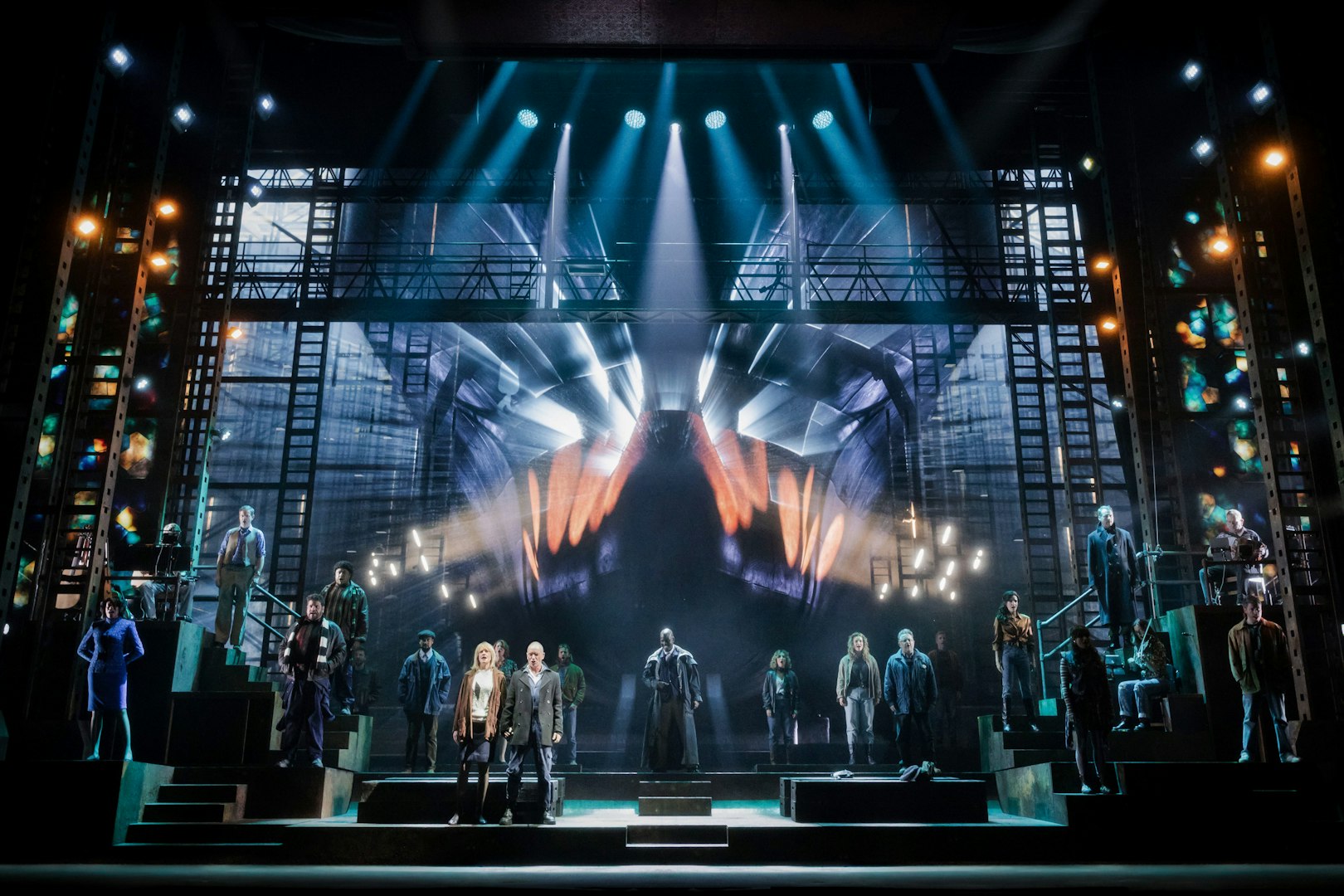 Stage performance of "The Last Ship" in Brisbane with cast on illuminated set.