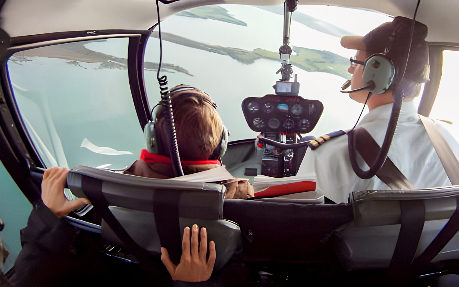Helicopter cockpit view over Phillip Island during scenic flight.