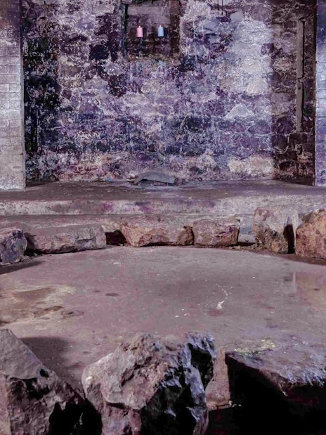 Stone circle in a dimly lit underground vault, part of the Terror Tour in Edinburgh.