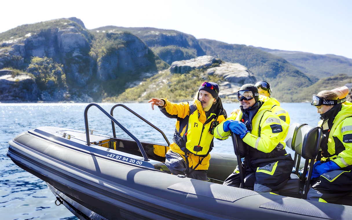 Guests on RIB boat with guide during Lysefjord Safari, Norway.