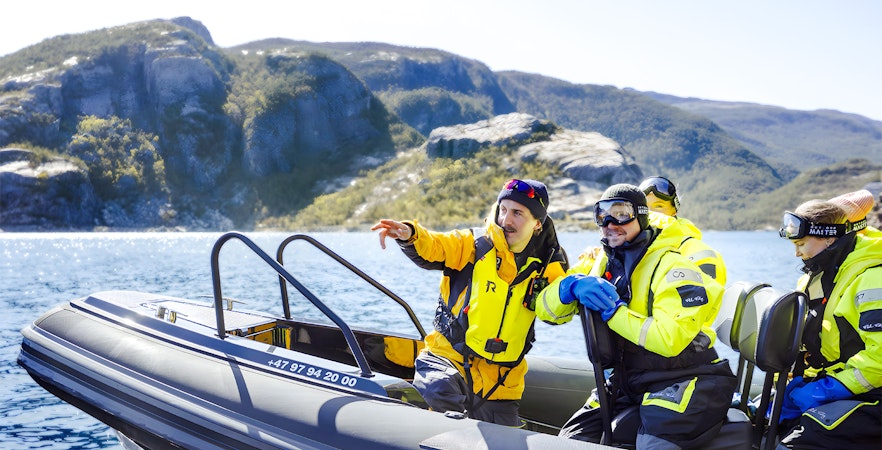 Guests on RIB boat with guide during Lysefjord Safari, Norway.