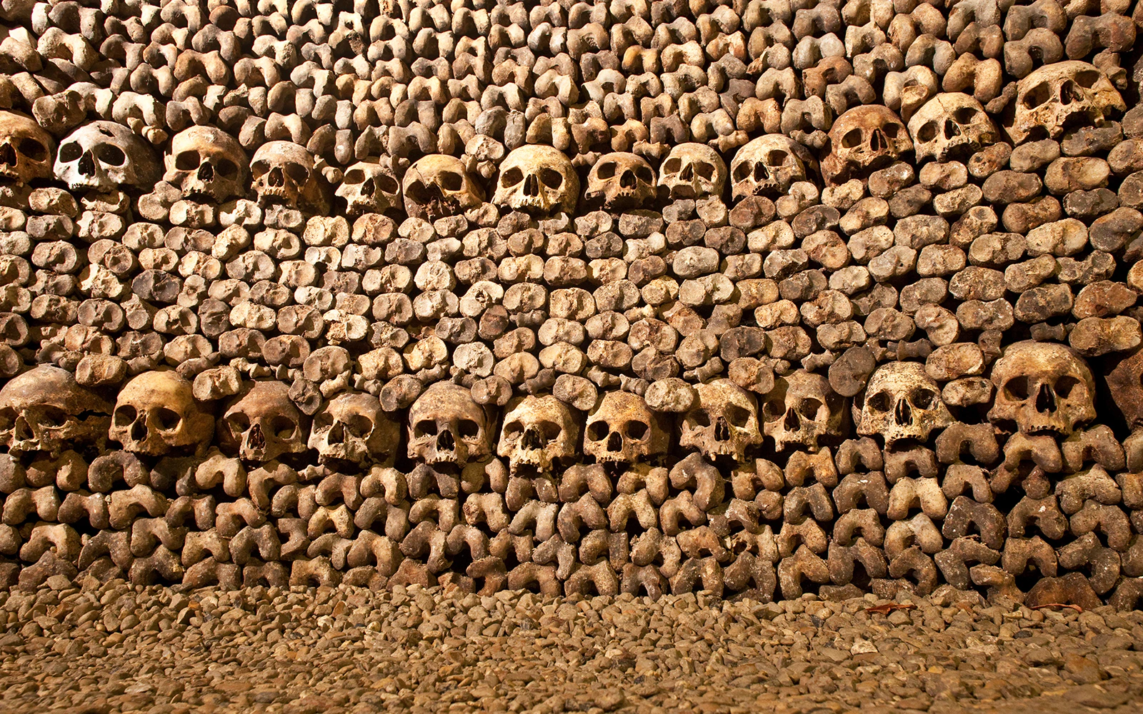 Skulls and bones arranged in the Paris Catacombs.