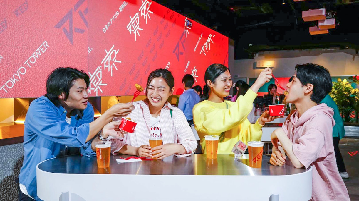 Friends eating at RED° TOKYO TOWER