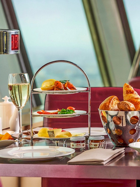 Food and drinks served at a table inside Berlin TV Tower restaurant.