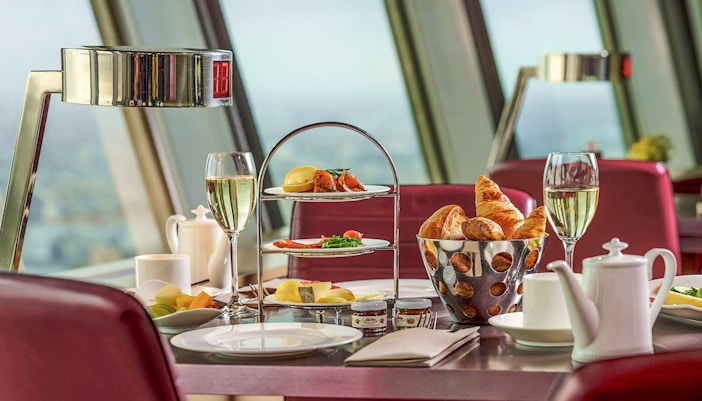 Food and drinks served at a table inside Berlin TV Tower restaurant.