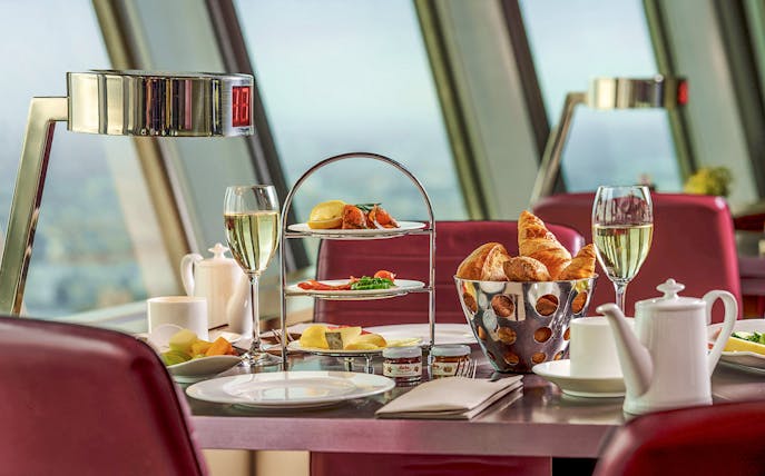 Food and drinks served at a table inside Berlin TV Tower restaurant.