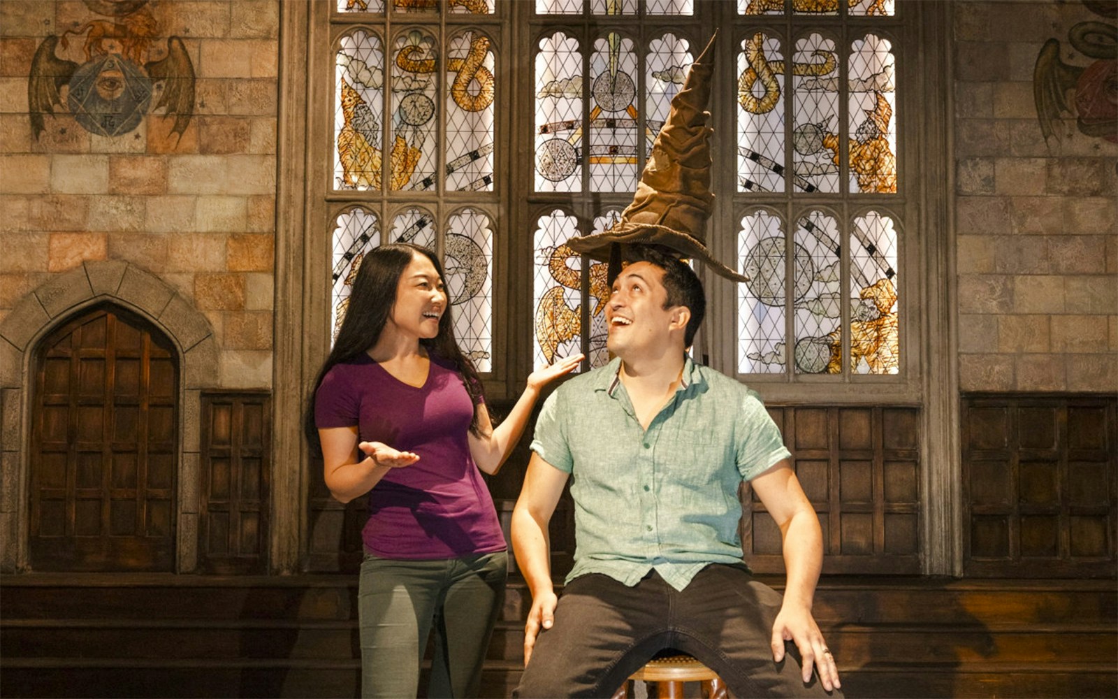 Sorting Hat experience at Warner Bros Studio, Los Angeles, with two visitors interacting.