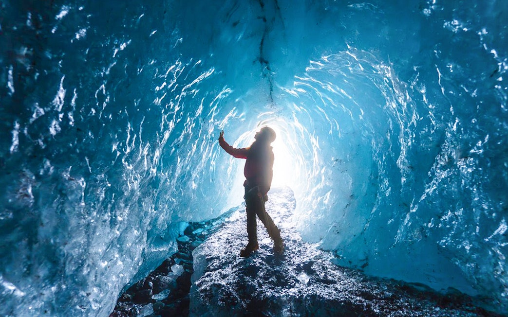 Guest exploring inside Blue Ice Cave, Vatnajökull, Iceland.