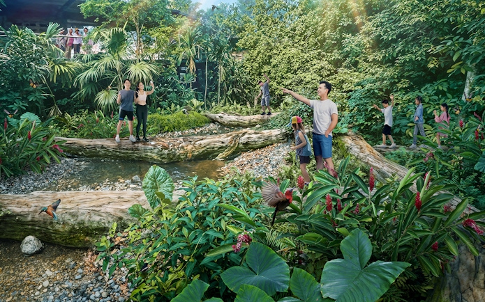 Visitors exploring lush greenery and wildlife in Rainforest Wild Asia.