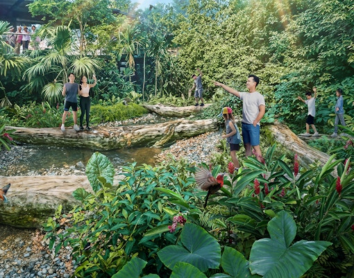 Visitors exploring lush greenery and wildlife in Rainforest Wild Asia.