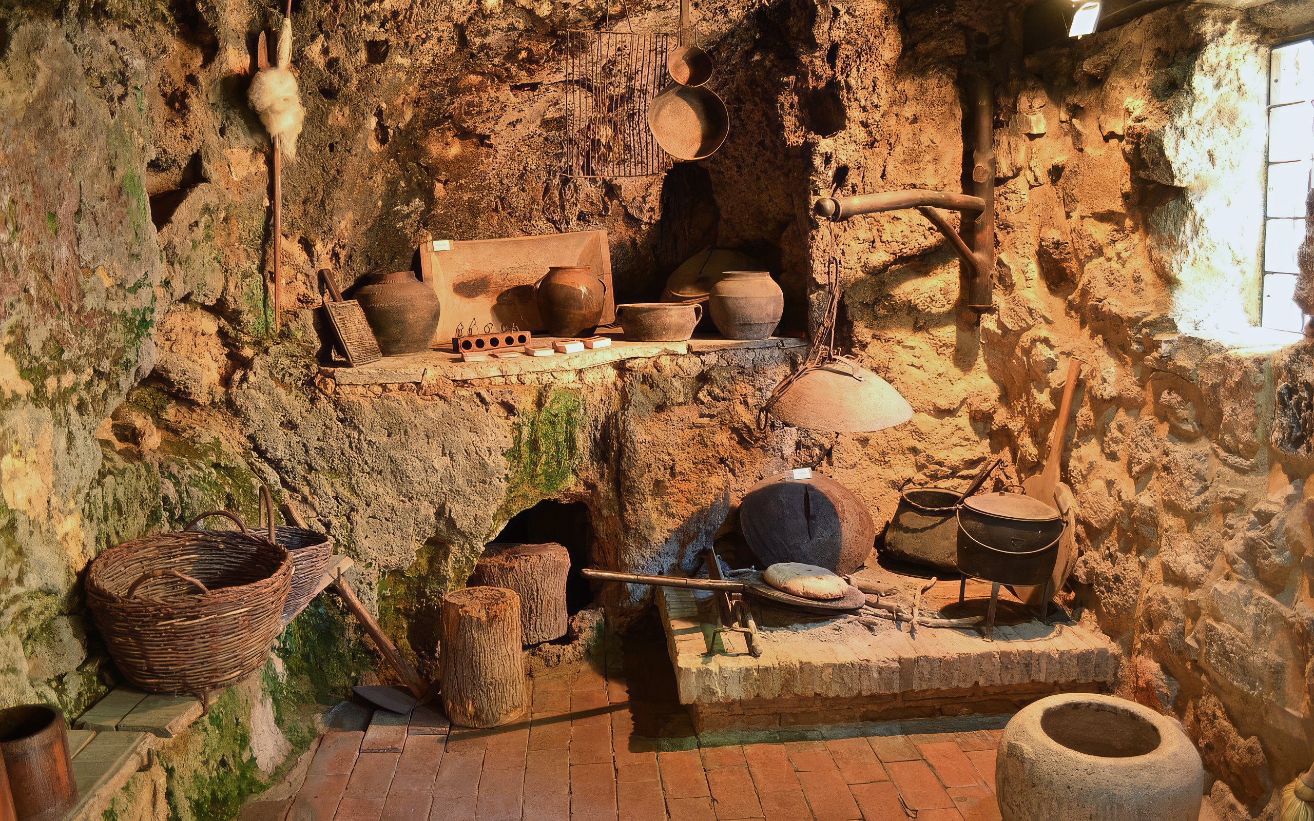 Traditional kitchen with rustic pottery and tools in Krka National Park.