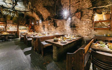 Medieval dining hall setup for a three-course dinner in Prague.
