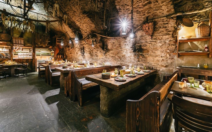 Medieval dining hall setup for a three-course dinner in Prague.