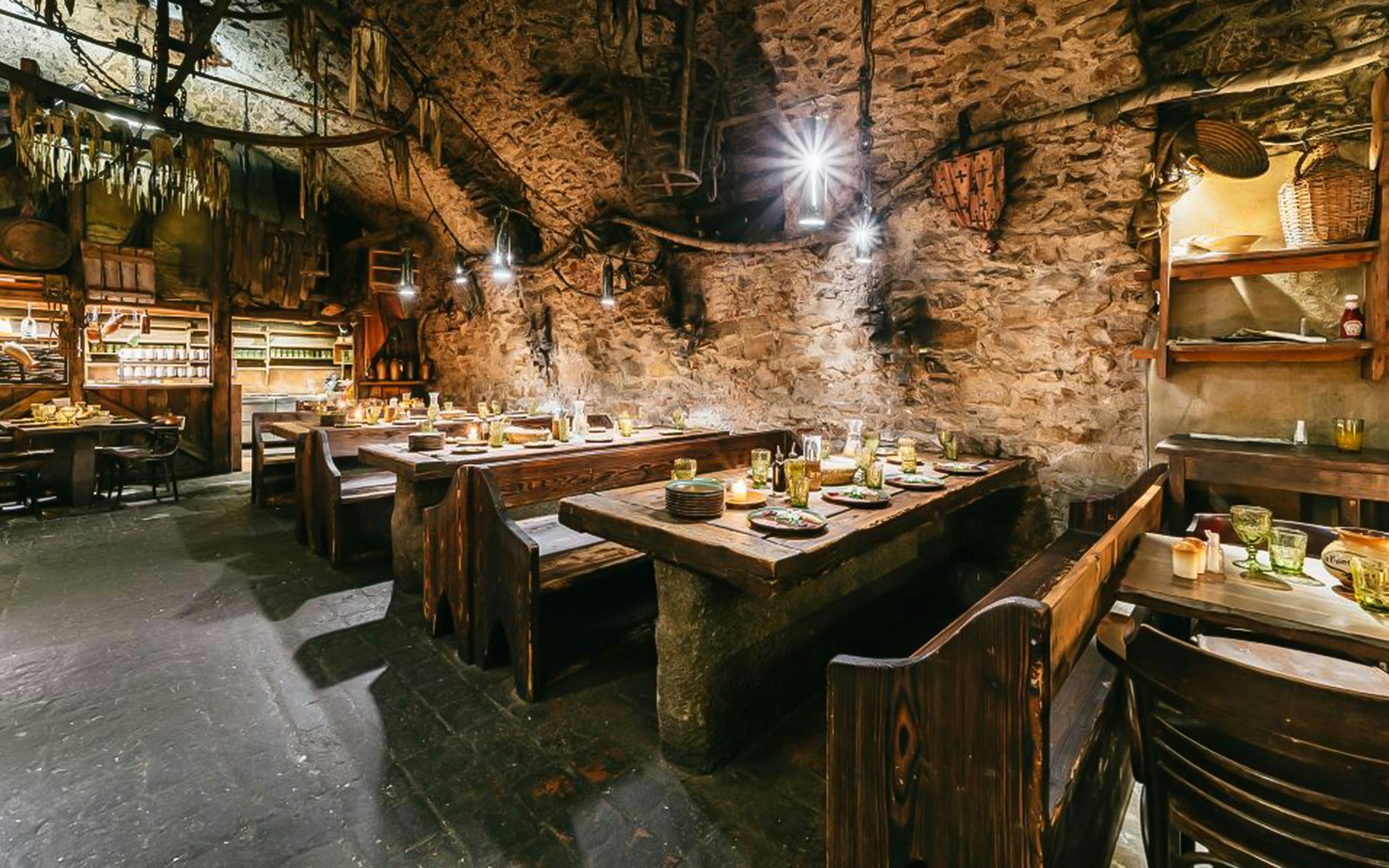 Medieval-themed dining hall with guests enjoying a three-course dinner in Prague.