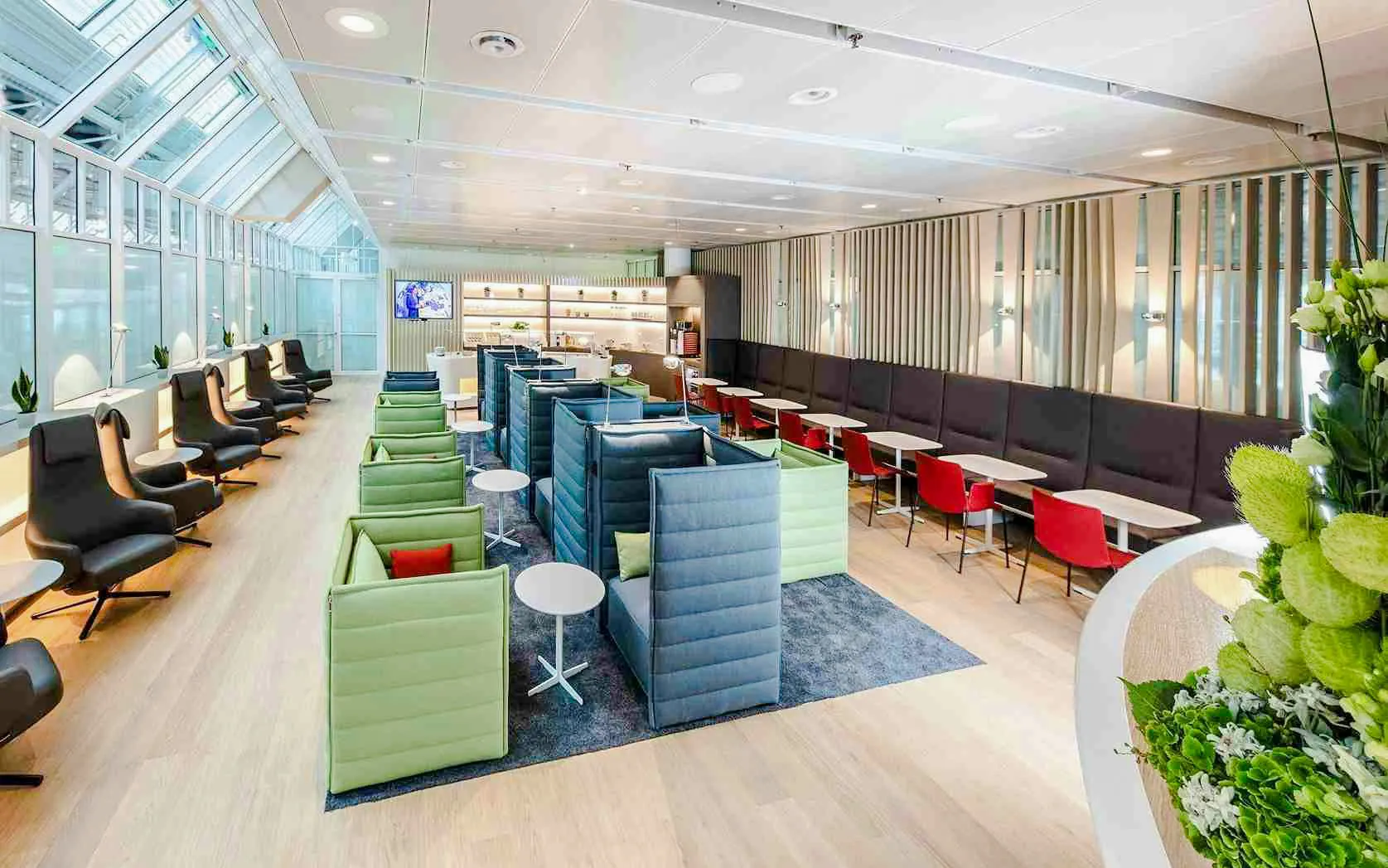 Airport Lounge seating area at Munich Airport Schengen Terminal 1 with modern decor.