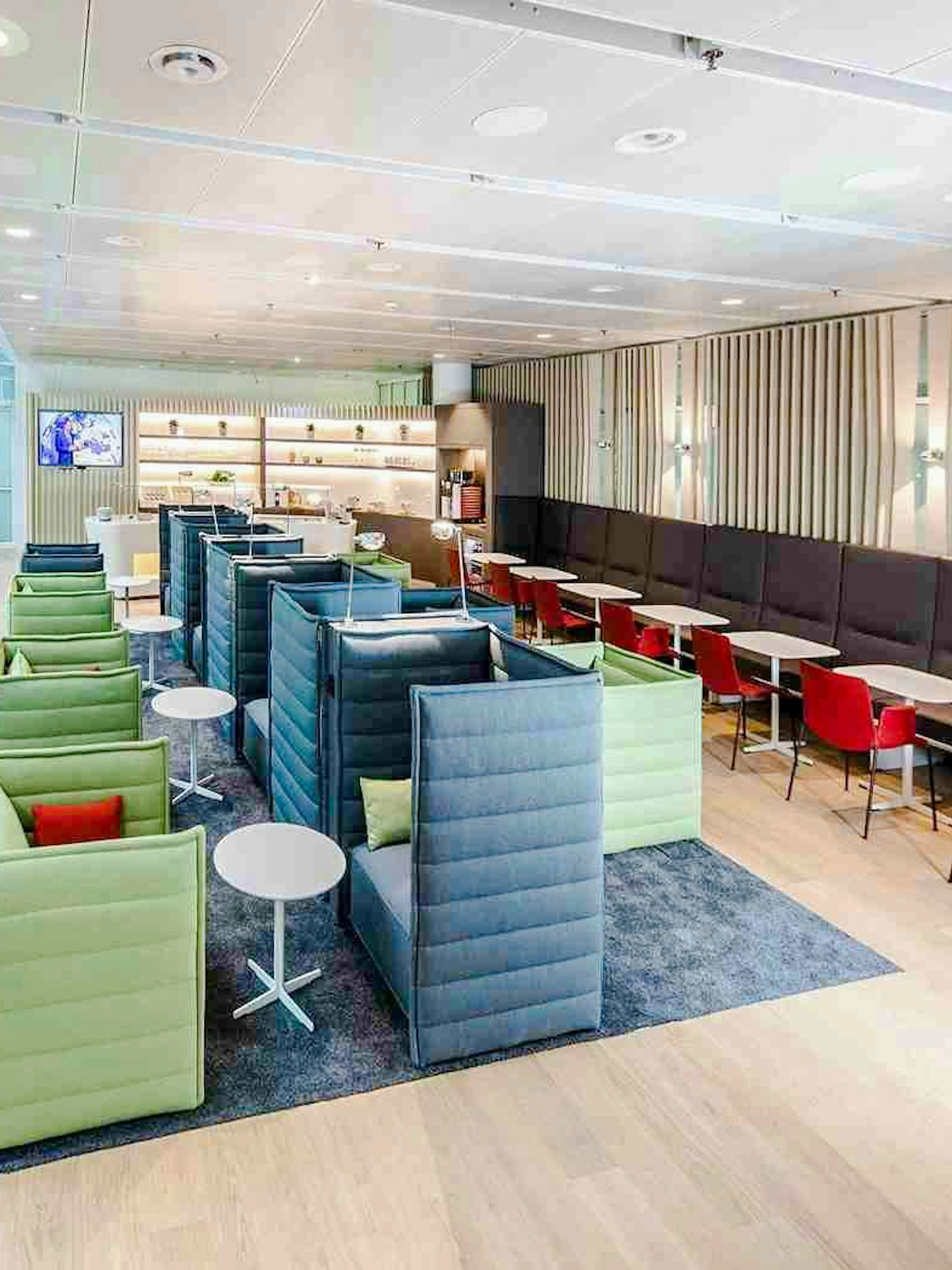 Airport Lounge seating area at Munich Airport Schengen Terminal 1 with modern decor.