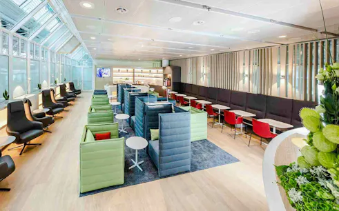 Airport Lounge seating area at Munich Airport Schengen Terminal 1 with modern decor.
