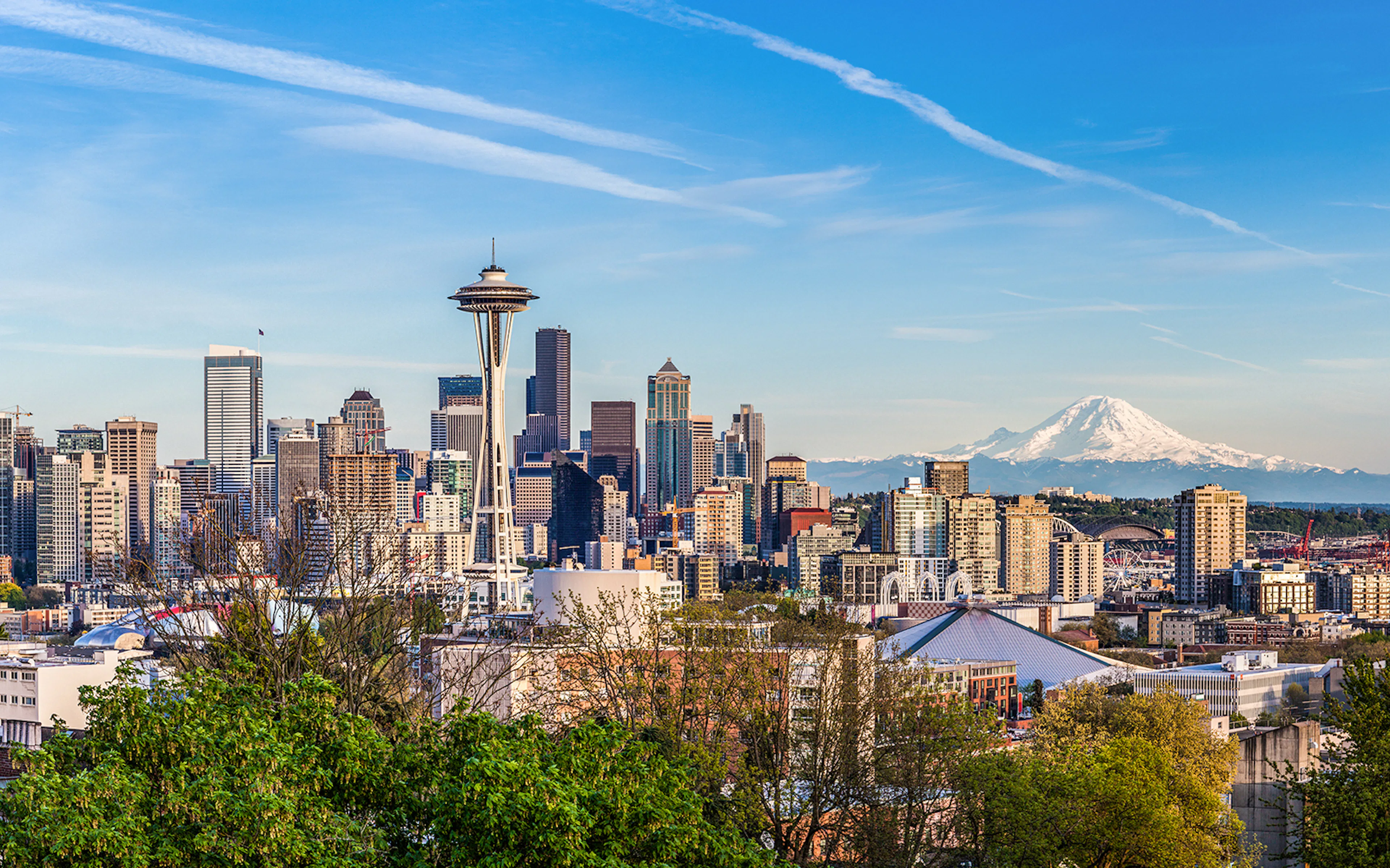 Seattle downtown skyline with Mt. Rainier in the background, viewed from a hop-on hop-off bus tour.