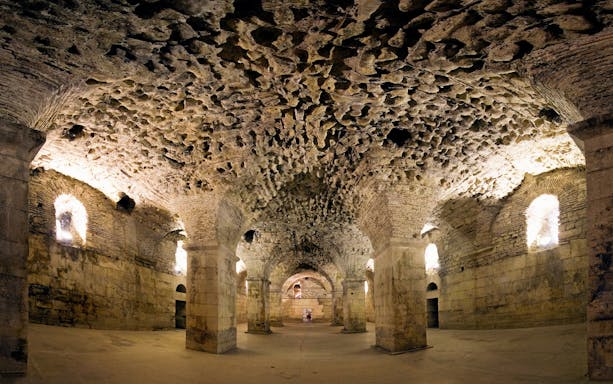 Cellars of Diocletian Palace with stone arches and vaulted ceilings, Split, Croatia.