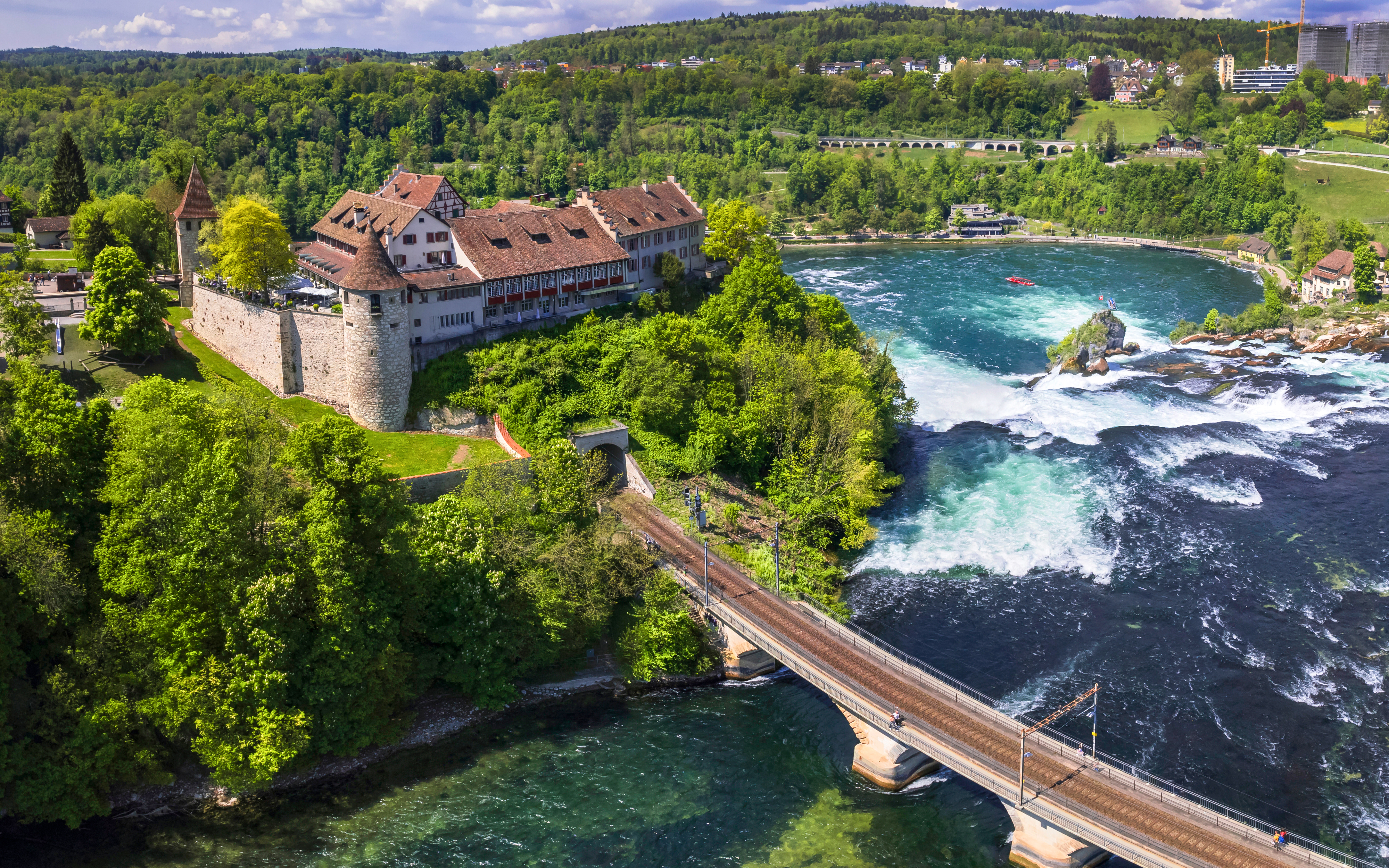 Aerial view of Schloss Laufen Castle overlooking Rhine Falls in Switzerland.