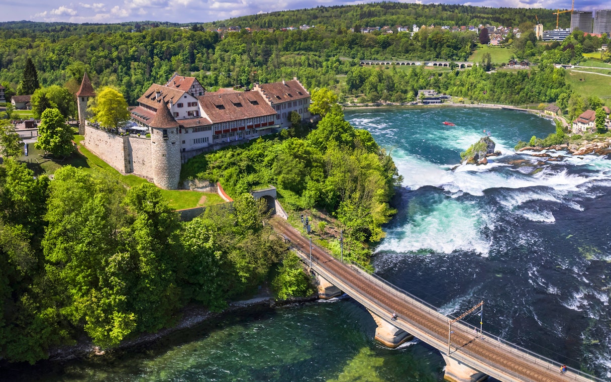 Aerial view of Schloss Laufen Castle overlooking Rhine Falls in Switzerland.
