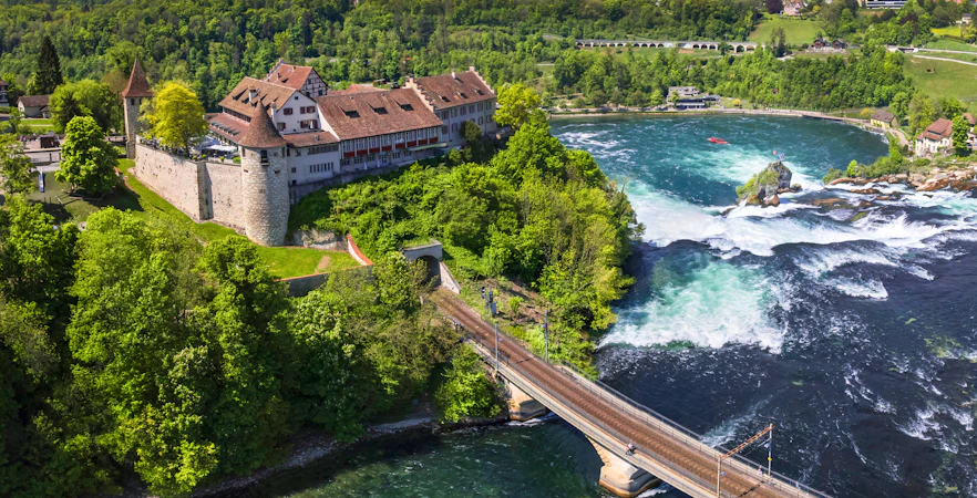 Aerial view of Schloss Laufen Castle overlooking Rhine Falls in Switzerland.