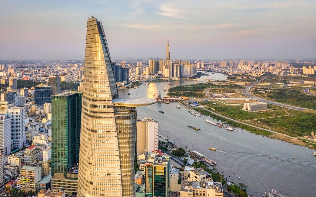 Panoramic view of Saigon cityscape with Landmark 81 and river.