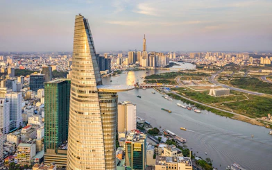Panoramic view of Saigon cityscape with Landmark 81 and river.