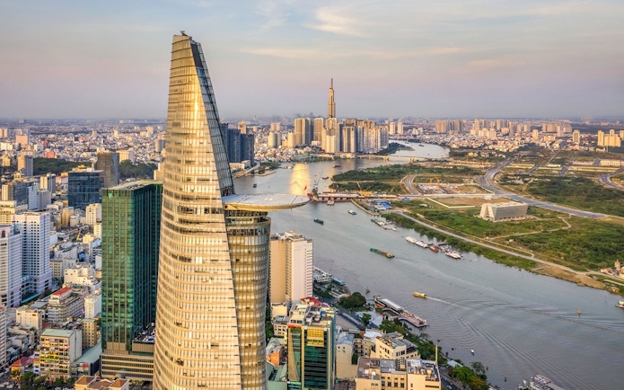 Panoramic view of Saigon cityscape with Landmark 81 and river.