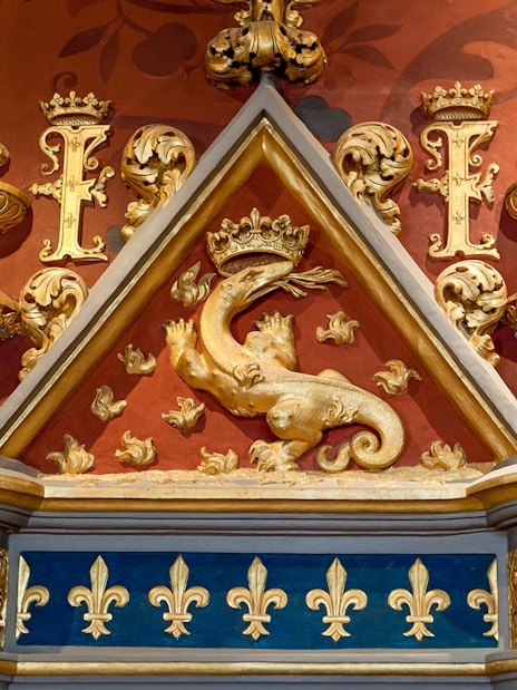 Royal Blois Castle ornate dragon and fleur-de-lis decoration.