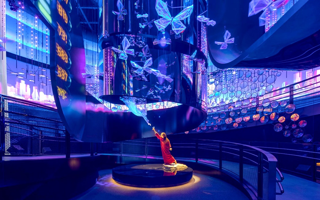 Interactive exhibit with digital butterflies at Expo City Dubai.