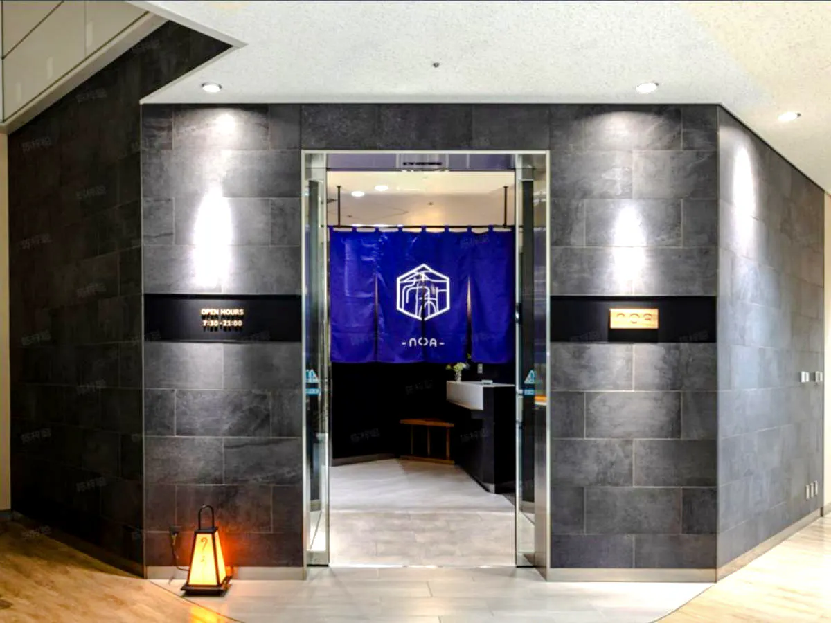 Entrance to I.A.S.S Superior Lounge at Narita Airport, Tokyo, with blue curtain and signage.