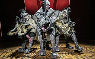 Hyena puppets in Lion King performance, West End theater.