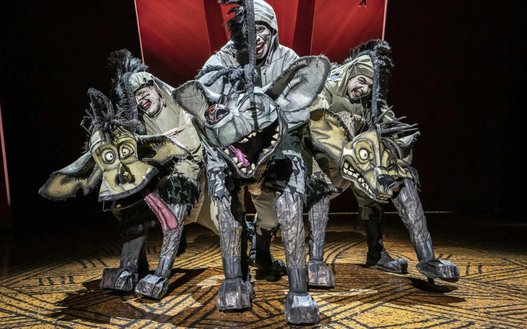 Hyena puppets in Lion King performance, West End theater.