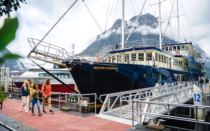 Tourists boarding the Milford Mariner vessel for an overnight Milford Cruise.