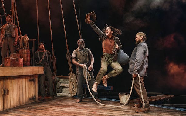 Sailors on a ship's deck, one jumping with joy, holding a hat, others watching.
