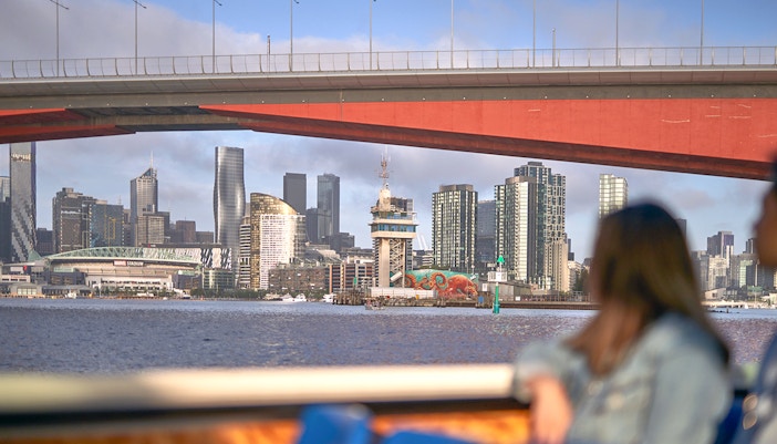 Melbourne River Cruise guests enjoying city skyline views from the Yarra River.