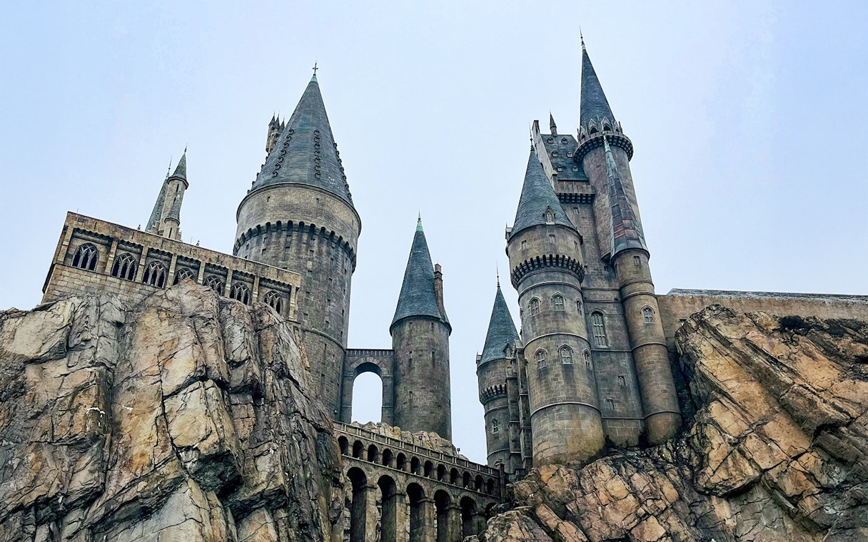 Hogwarts castle at Universal Studios Orlando, featuring stone towers and rocky landscape.