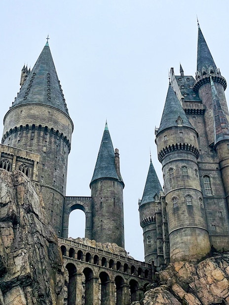 Hogwarts castle at Universal Studios Orlando, featuring stone towers and rocky landscape.